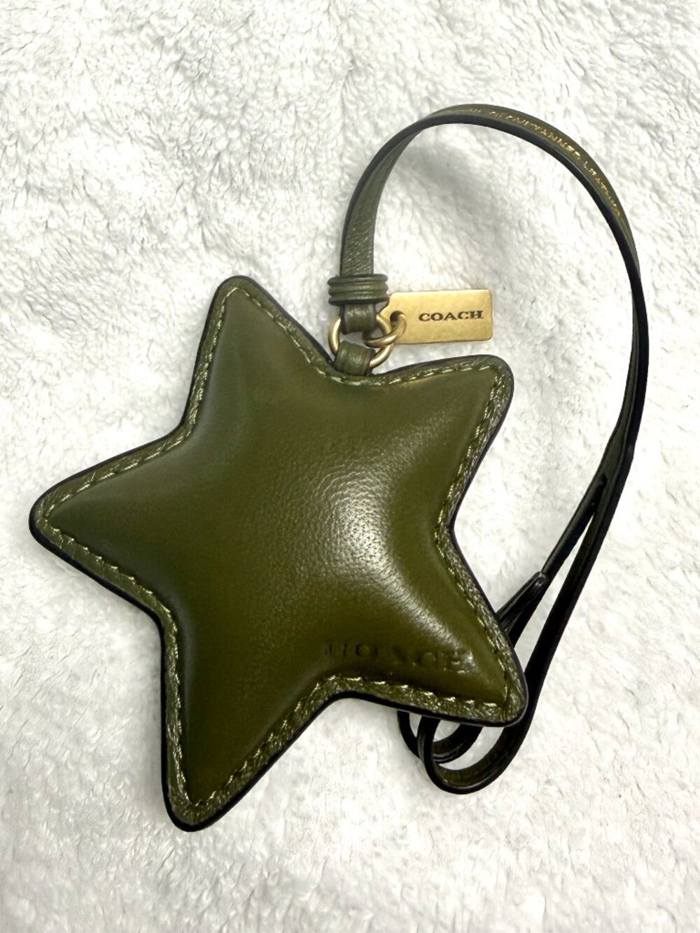 Like new Coach puffy olive star.  Fast shipper.